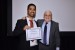 Dr. Nagib Callaos, General Chair, giving Dr. Rodrigo Lopez-Farias the best paper award certificate of the session "Computer Science and Engineering." The title of the awarded paper is "Adaptive Nearest Neighbors Phase Space Reconstruction for Short-Time Prediction in Chaotic Time-Series."